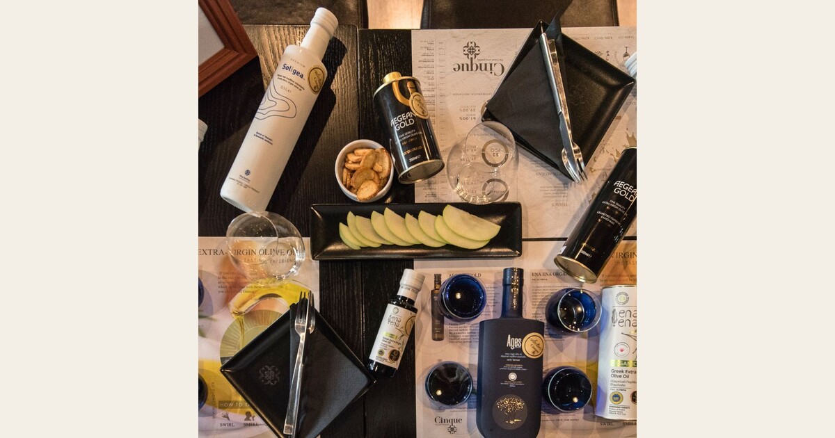 Greek olive oil dining experience with premium extra virgin olive oils, tasting glasses and shared dishes at Cinque Wine & Deli Athens.