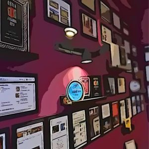 Awards wall at Cinque Wine & Deli showcasing multiple international recognitions and years of top ratings in Athens