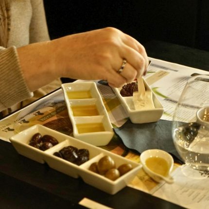 Advanced Greek extra virgin olive oil tasting with olive oil samples and traditional accompaniments at Cinque Wine & Deli Athens.