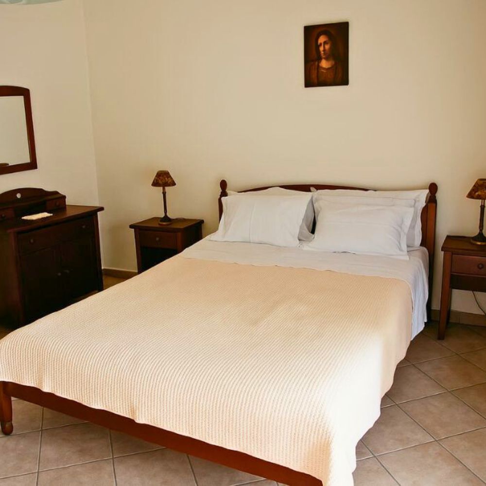Traditional bedroom in the Assyrtiko Suite at Casa Cinque in Lamia, Central Greece