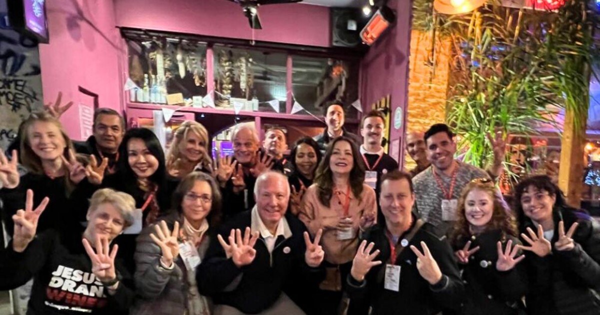 Group of pilots and friends celebrating retirement at Cinque Wine & Deli in Athens, known as a favorite stop for airline crews.