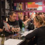 Founder hosting a private wine experience with guests at Cinque Psirri wine bar in Athens