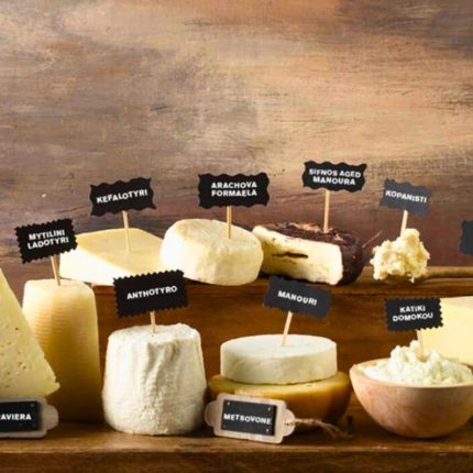 Selection of traditional Greek artisan cheeses including graviera, metsovone, manouri and kopanisti presented for tasting at Casa Cinque