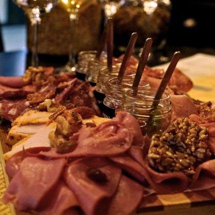 Greek charcuterie tasting board with traditional cured meats and homemade chutneys at Cinque Wine & Deli