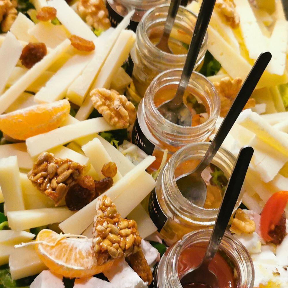 Greek cheese tasting experience with artisanal cheeses, handmade chutneys, honey and nuts at Cinque Wine & Deli.