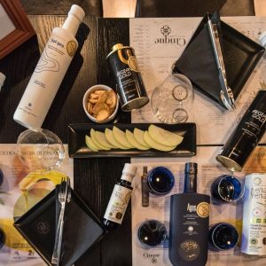 Greek olive oil dining experience with premium extra virgin olive oils, tasting glasses and shared dishes at Cinque Wine & Deli Athens.