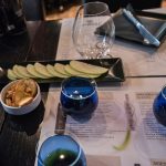 Greek olive oil and food pairing tasting with professional blue glasses, bread and fresh ingredients at Cinque Wine & Deli Athens.