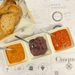 Greek sauce tasting with Florina red pepper sauce, tomato sauce and olive paste served with freshly baked bread at Cinque Wine & Deli