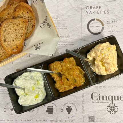 Traditional Greek spreads tasting with tzatziki, eggplant spread and kopanisti served with toasted bread at Cinque Wine & Deli
