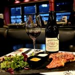 Greek steak paired with red wine during a lunch wine pairing experience at Cinque Wine & Deli