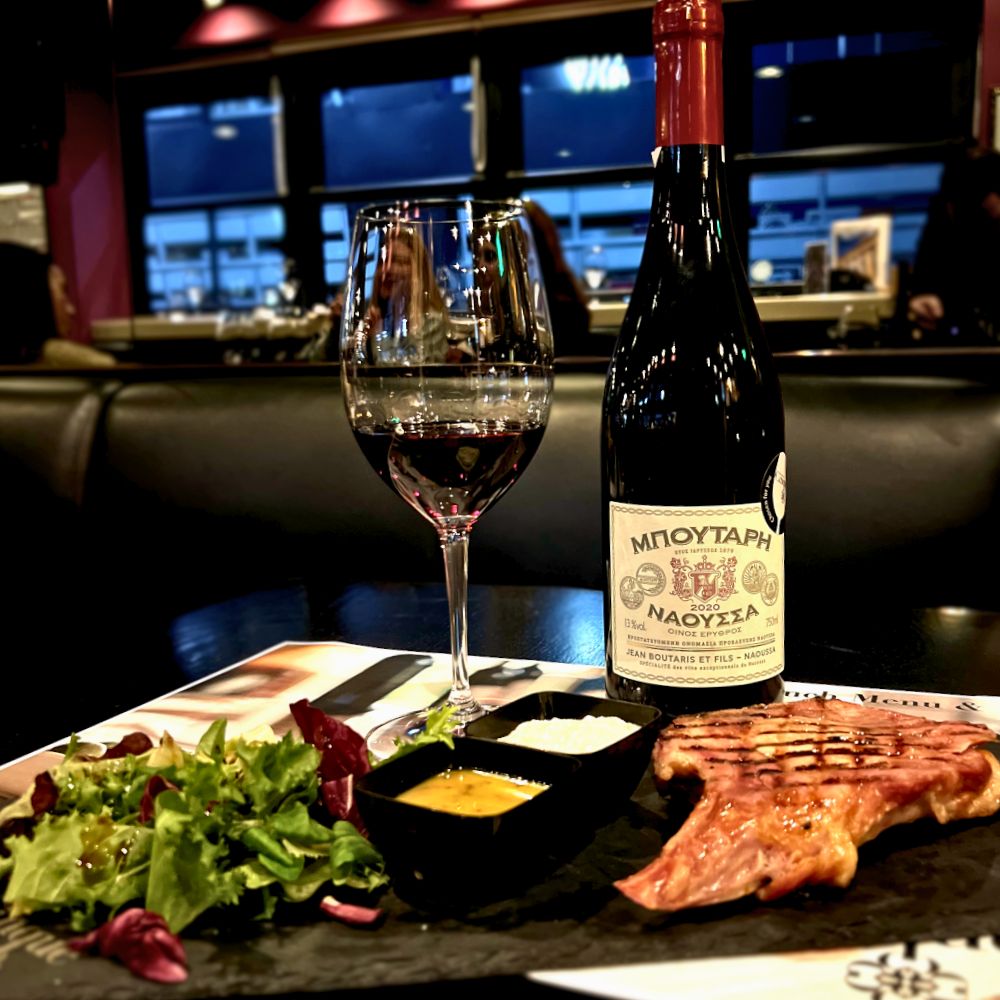 Greek steak paired with red wine during a lunch wine pairing experience at Cinque Wine & Deli