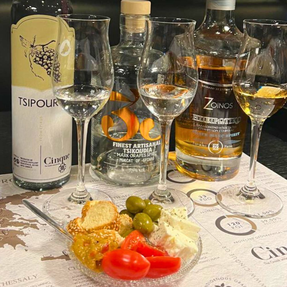 Greek tsipouro and raki tasting with Muscat of Tyrnavos tsipouro, Cretan raki and oak-aged Debina tsipouro served with traditional meze at Cinque Wine & Deli