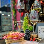Picnic-style Greek wine tasting with white, rosé, red and sweet wines, fresh grapes and bread at Cinque Wine & Deli