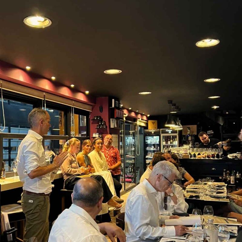 Guests attending the Le Goût de Grèce Greek wine tasting event at Cinque Wine & Deli Monastiraki in Athens
