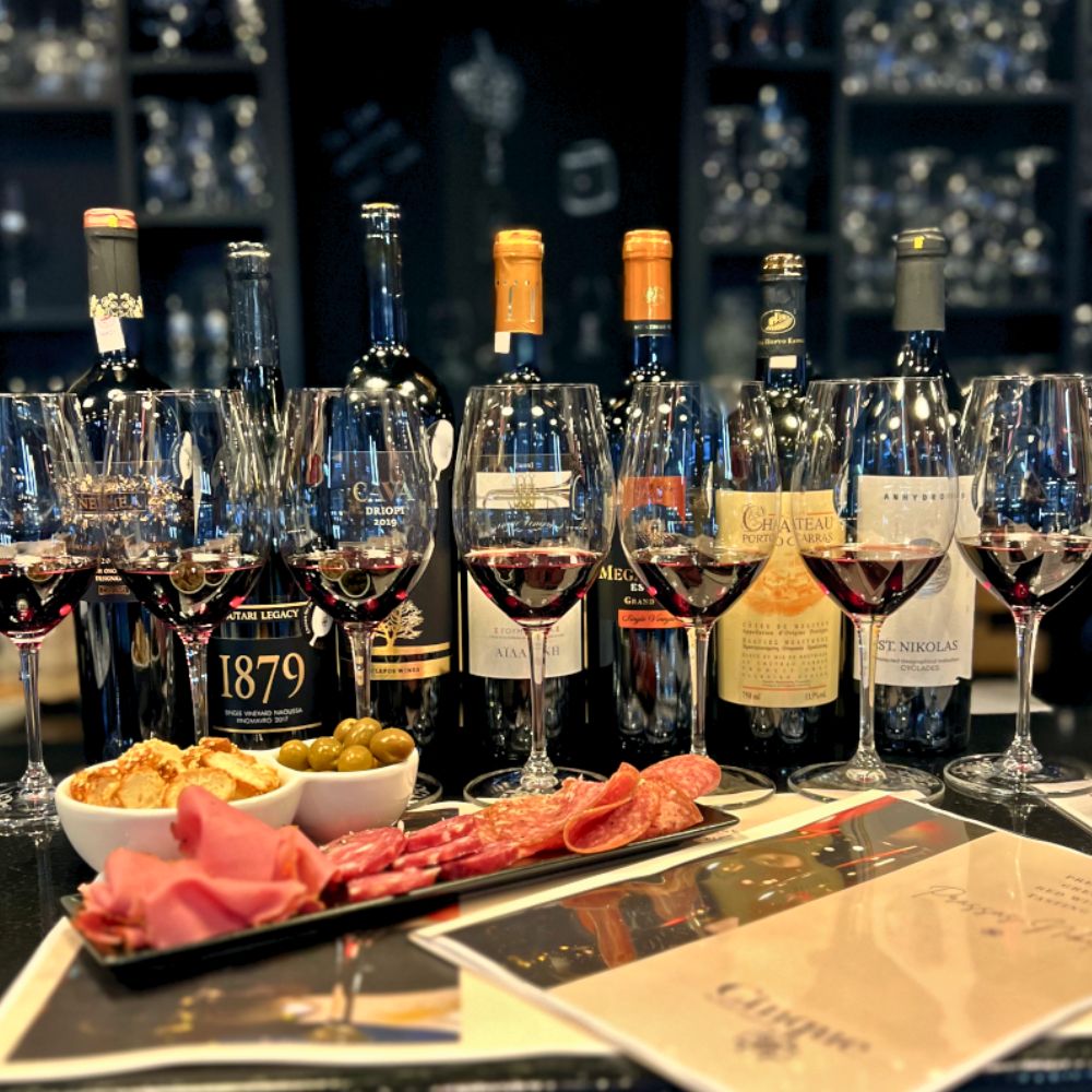 Premium Greek red wine tasting with seven wines, charcuterie and olives at Cinque Wine & Deli