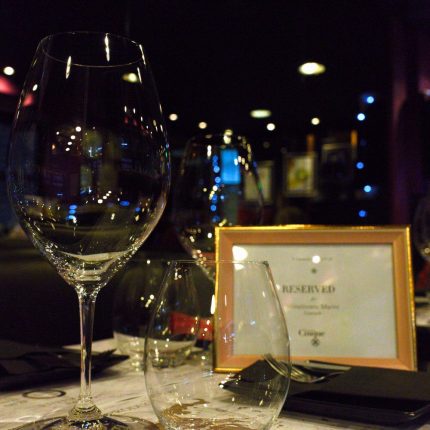Reserved wine glasses on a table at Cinque Wine & Deli Monastiraki wine bar in Athens