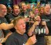 Team-bonding wine experience at Cinque Wine & Deli with a group raising glasses and celebrating together