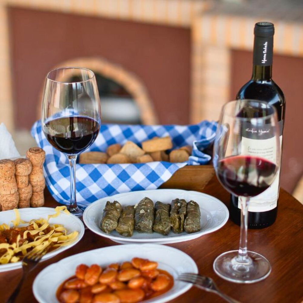 Traditional Greek dinner with dolmadakia, beans and red wine served at Casa Cinque