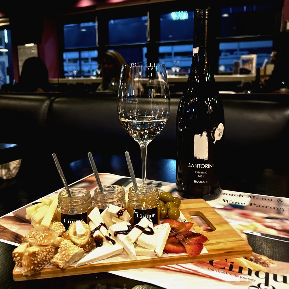 Vegetarian lunch wine pairing with Greek cheese board, olives and Santorini Assyrtiko at Cinque Wine & Deli