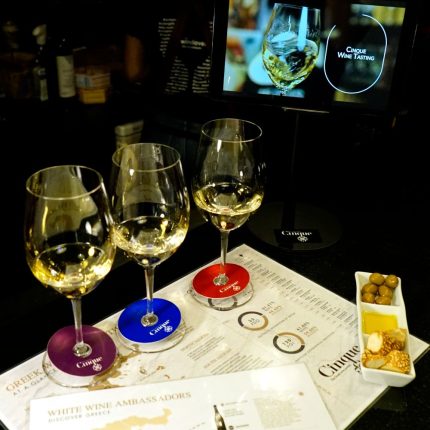 Private Greek wine tasting experience with three glasses of Greek white wine at Cinque Wine & Deli Network in Athens