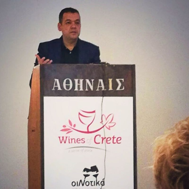 Grigoris Prassas speaking at the Crete Wine Destination conference during OiNotika Wine Fair in Athens, representing Cinque Wine & Deli and Greek wine tourism.