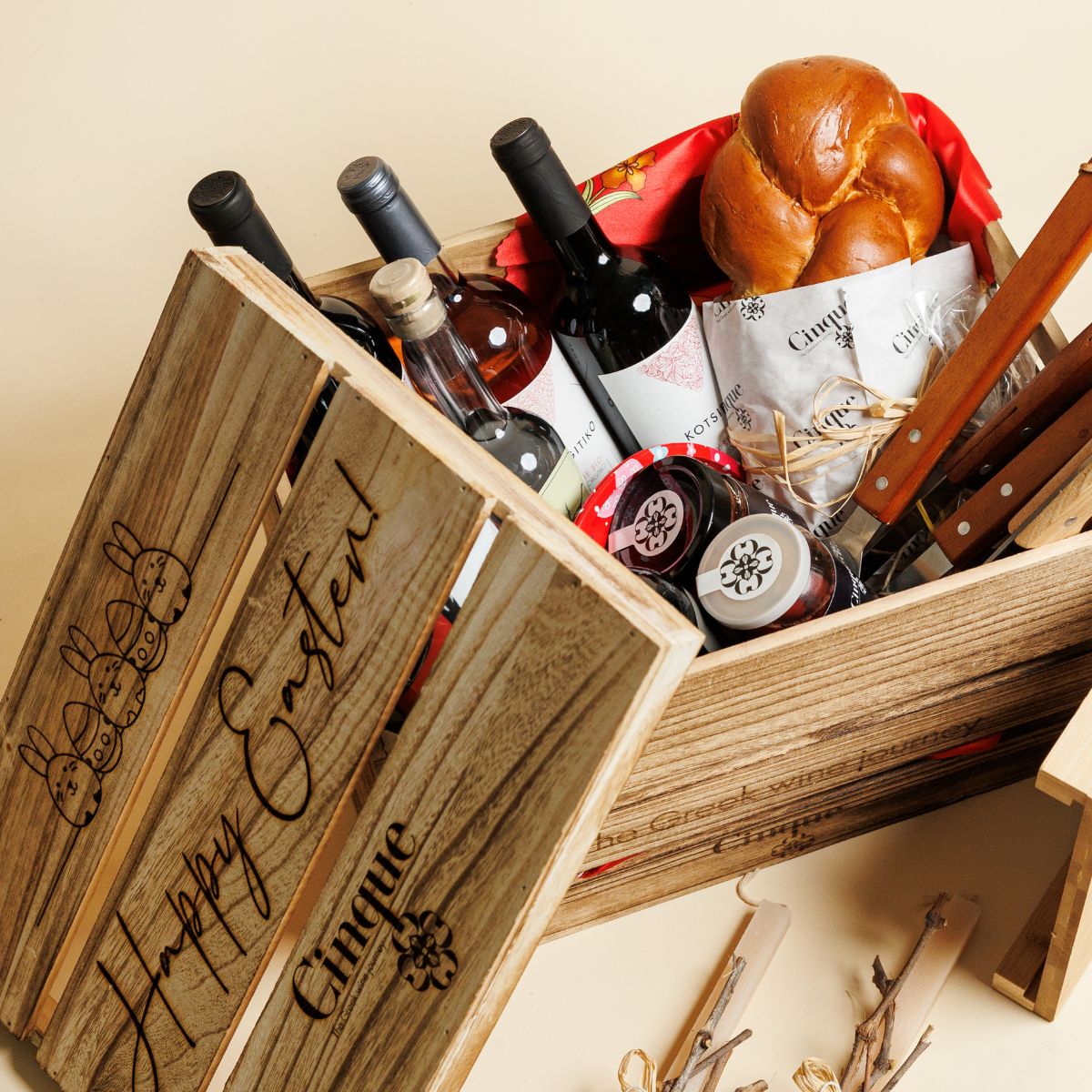 Greek Easter basket with wine bottles, tsoureki, deli products and spirits by Cinque Wine & Deli