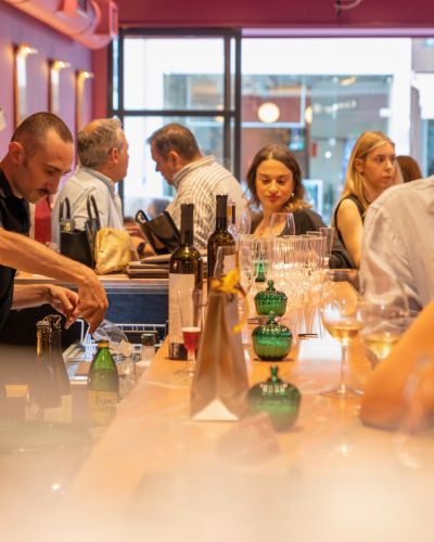 Wine glasses and Greek wine service at the bar of Cinque Wine & Deli Glyfada.