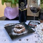 Homemade chocolate biscuit mosaic dessert with powdered sugar paired with sweet Mavrodaphne wine at Cinque Athens.