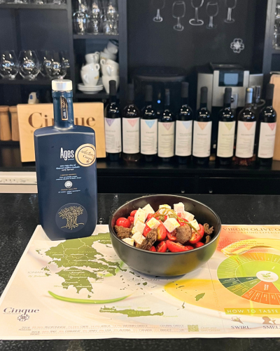 Cretan salad with tomatoes, feta and rusks paired with AGES Early Harvest extra virgin olive oil.