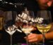 Wine tasting experience at Cinque Wine & Deli, with a sommelier pouring Greek wine into tasting glasses during a guided tasting session.