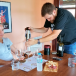 Nikitas Prassas pouring wine during a private Cinque winery tasting