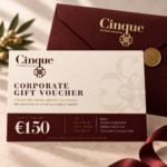 Cinque €150 corporate gift voucher in ivory, burgundy and gold, displayed with a burgundy envelope.