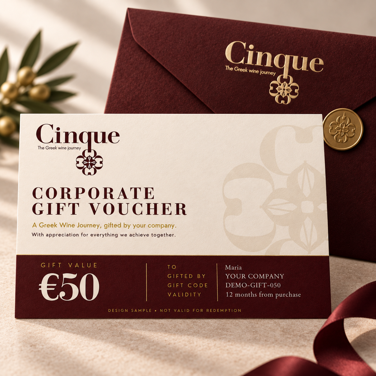 Cinque Corporate Gift Voucher €50 – Ivory Card with Burgundy Envelope Cinque €50 corporate gift voucher in ivory, burgundy and gold, displayed with a burgundy envelope.